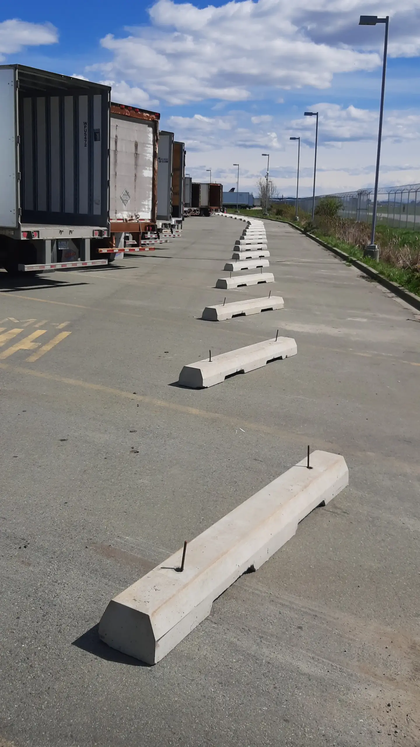 concrete parking stops install Canada Post YVR